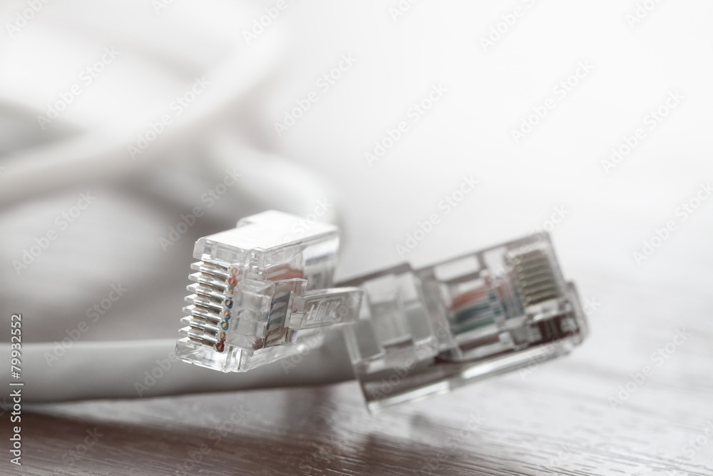 close up of RJ45 Plug Lan Network on wood desk close up of RJ45 Plug Lan Network on wood desk