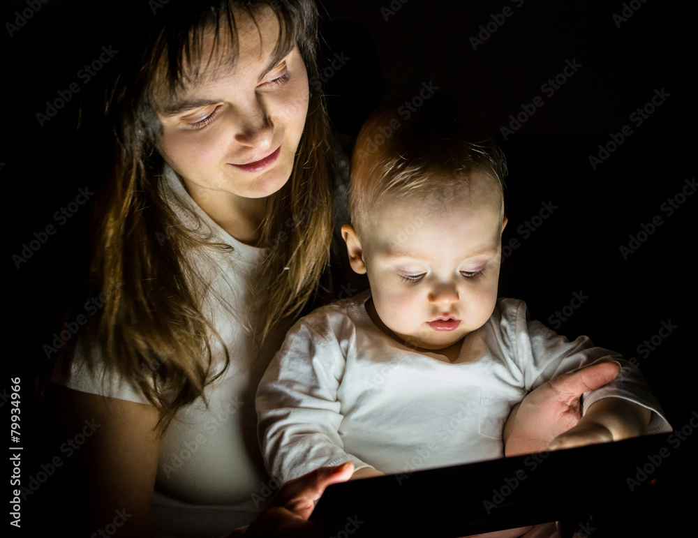 Modern world - mother, baby and tablet Modern world - mother, baby and tablet