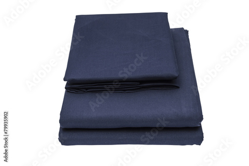 Folded bed linen on white isolated background