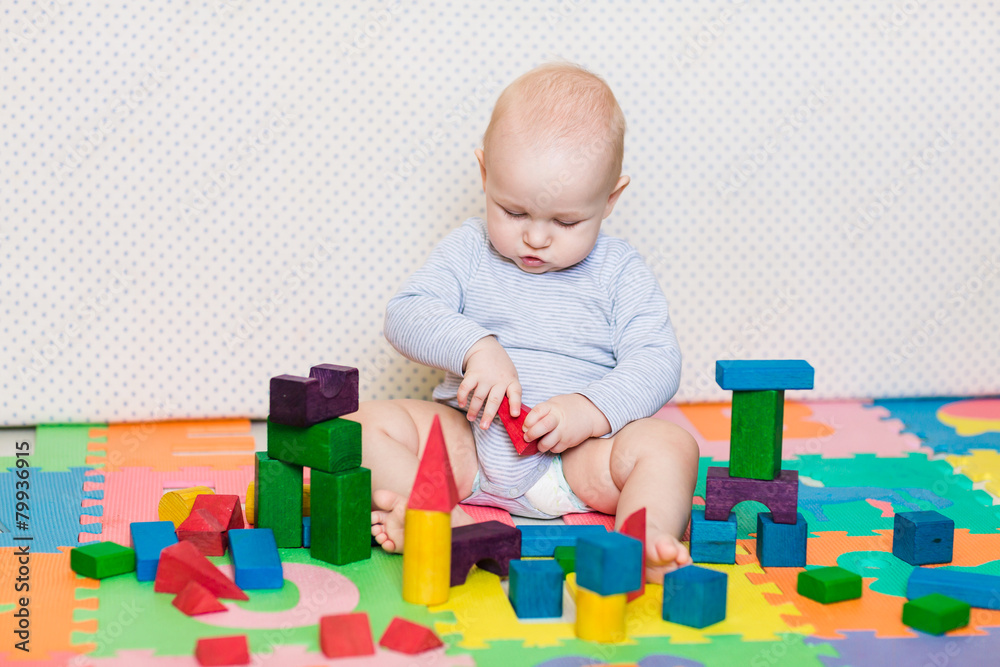 Cute little baby playing with colorful toys Cute little baby playing with colorful toys