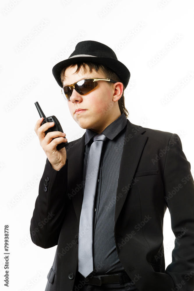 Teenage boy posing like a guardsman with radio transmitter Teenage boy posing like a guardsman with radio transmitter