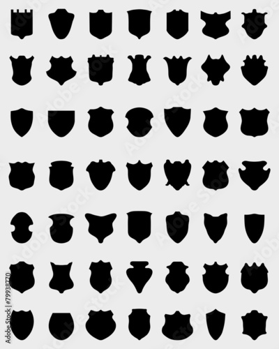 Black silhouettes of shields on white a background, vector