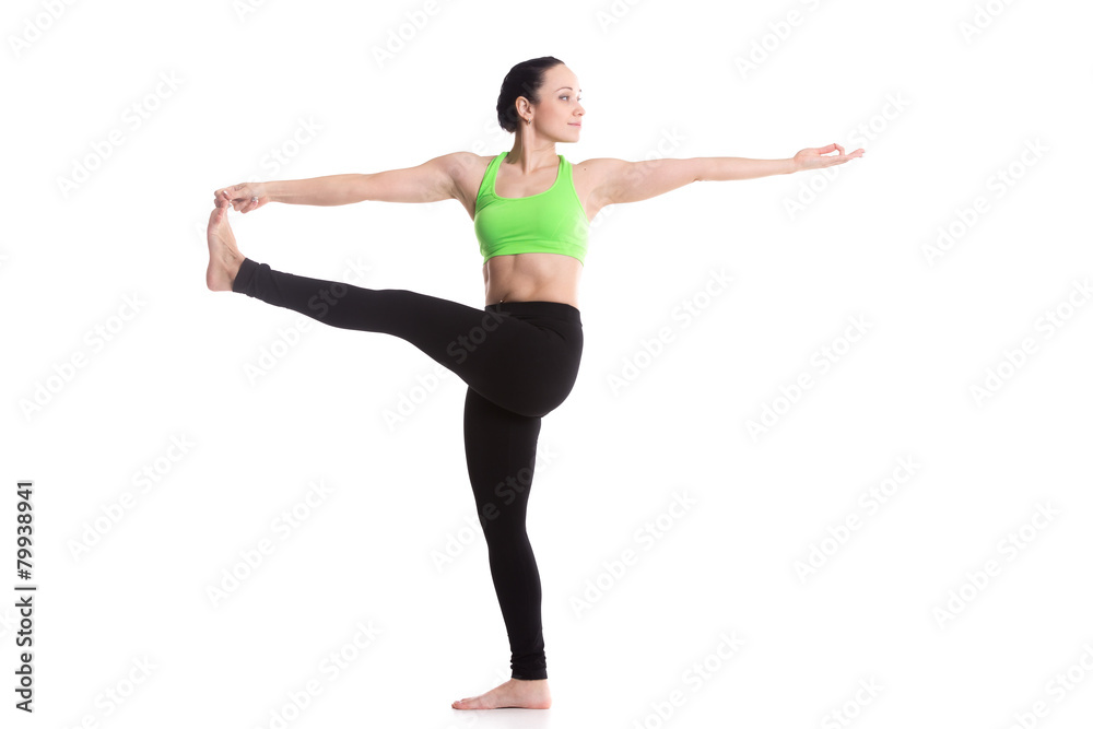 Stretched hand grasps big toe yoga asana