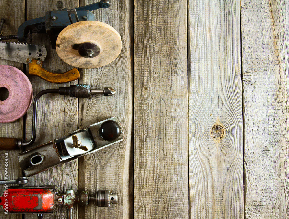 Various tools on a wooden background. Various tools on a wooden background.