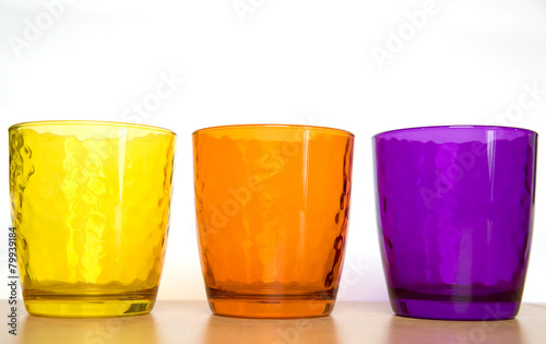 colorful glass cups on a white background