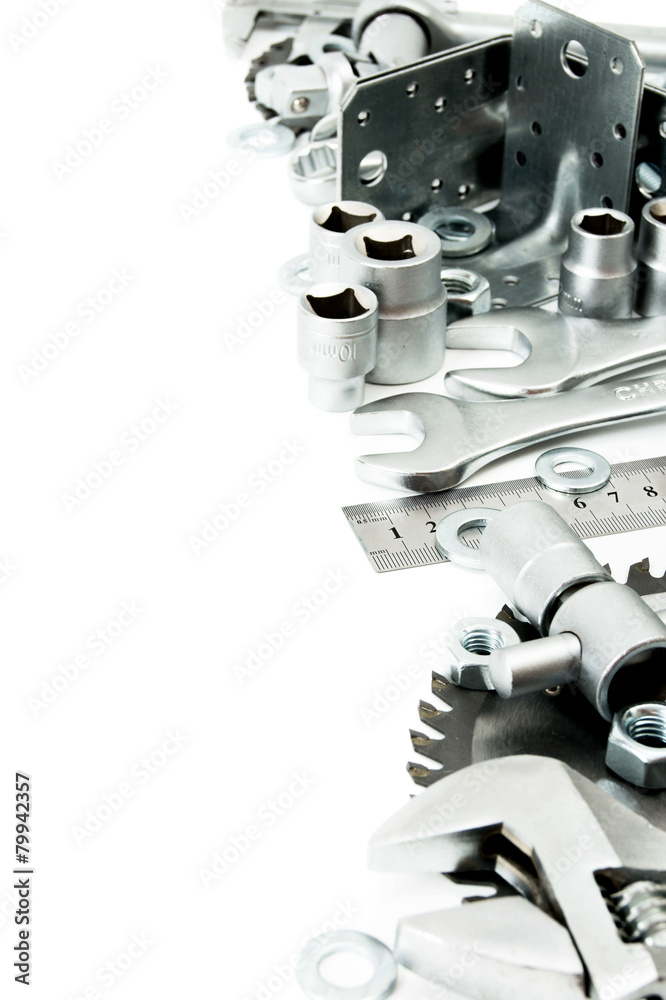 Metalwork. Spanner, ingot and others tools on white background. Metalwork. Spanner, ingot and others tools on white background.