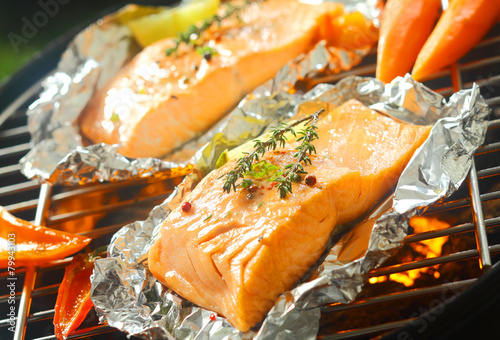 Fresh marine salmon grilling over a barbecue