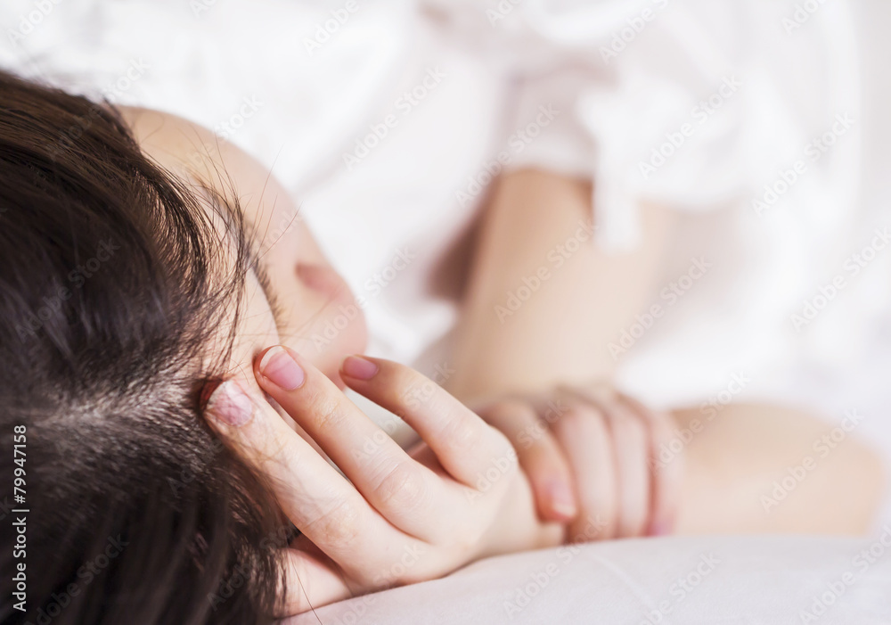 Sick woman on the bed at home Sick woman on the bed at home