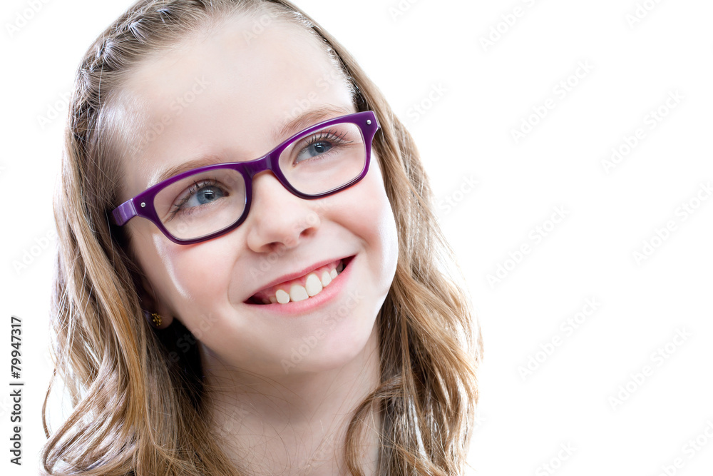 Cute girl with glasses looking at upper corner.