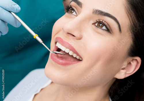 Fotografie Teeth examined by dentist