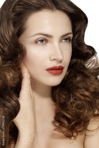 Beautiful model showing healthy brown wavy hair