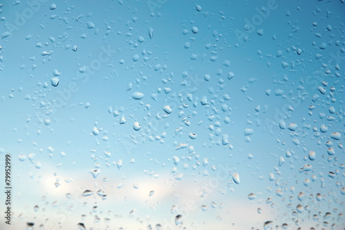 Water drops on a window glass, rainy day © Devyatkin