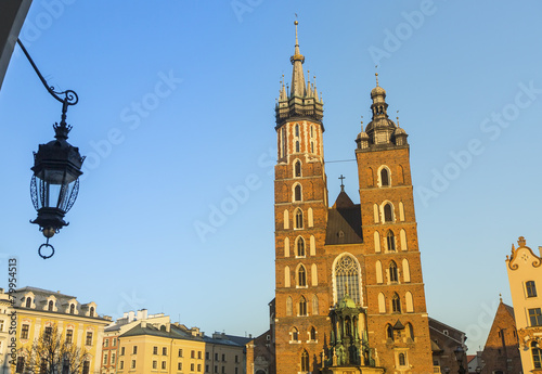 Mariacki church in Rynek Glowny - The main square of Krakow. photo