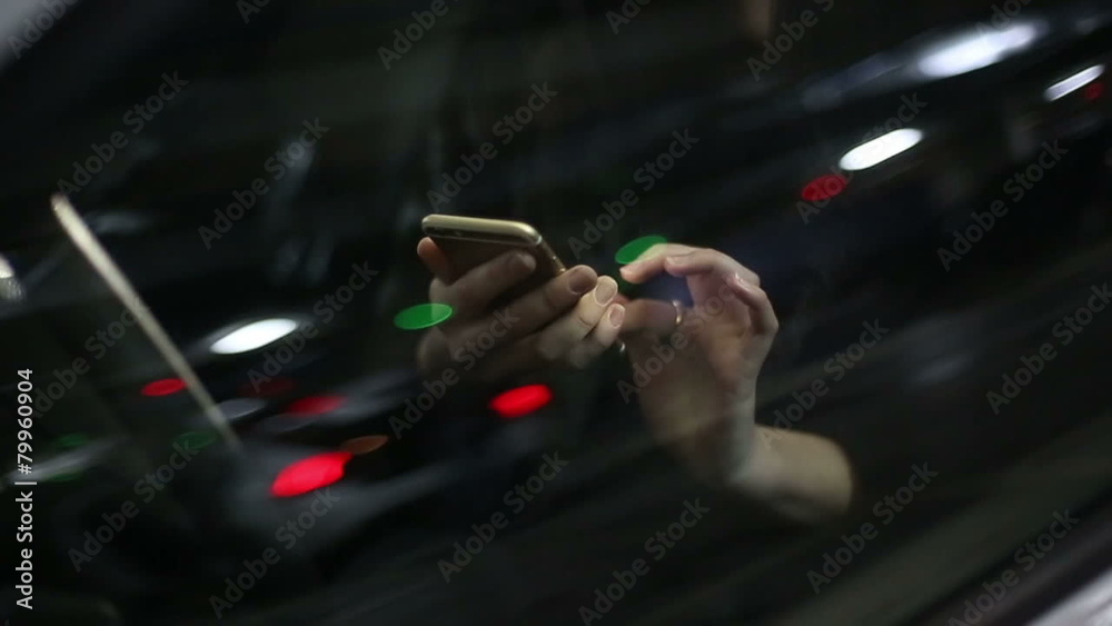 Young attractive woman using mobile phone in the car Young attractive woman using mobile phone in the car