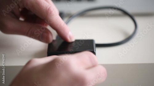 Wallpaper Mural Hand inserting SD card 16Gb in memory card reader Torontodigital.ca