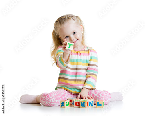 child plays with building b...