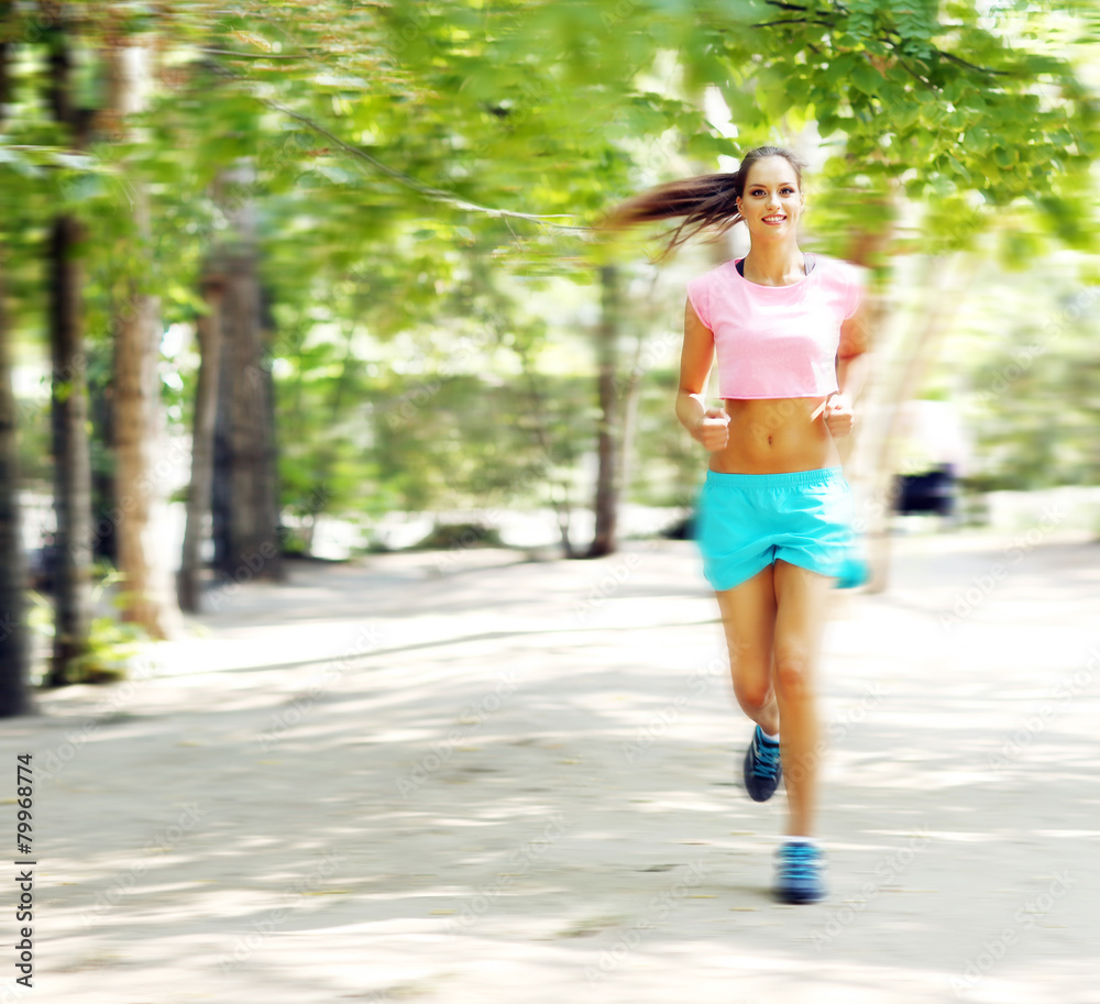 Young woman jogging at park Young woman jogging at park