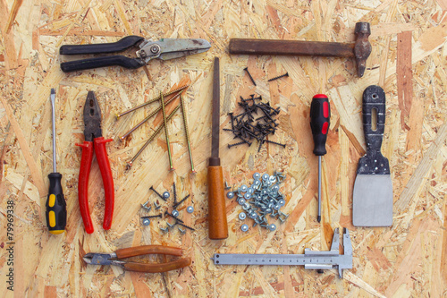 Construction tools on wooden background. photo