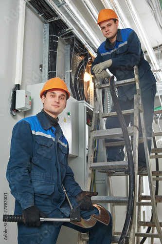 two electrician workers at cabling