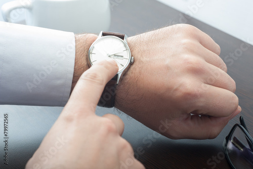 Businessman checking his watch