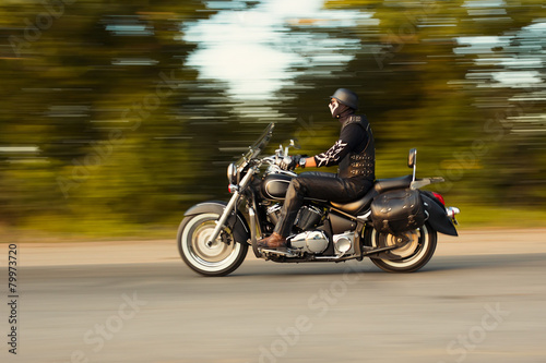 slow motion, biker riding motorbike with blur movement, speed co