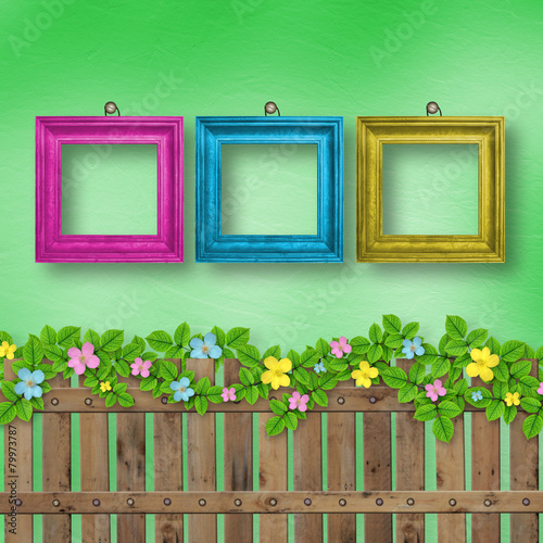 Wooden fence with a flower garland on the abstract background of