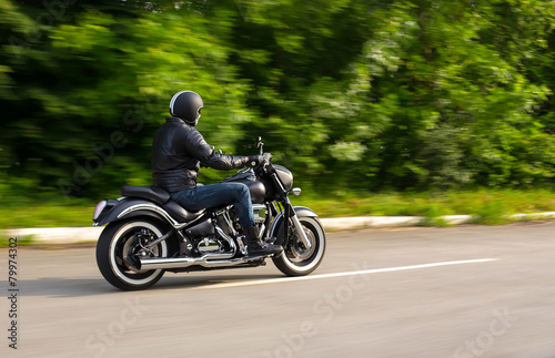 slow motion, biker riding unknown motorbike with blur movement,