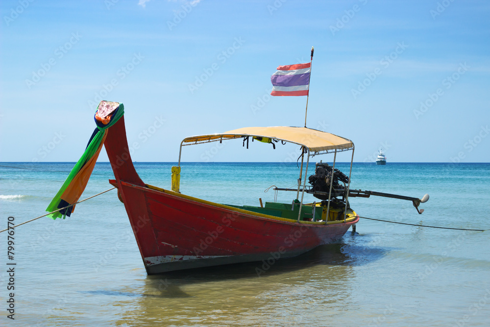 Long-tailed Thai boat near the shore