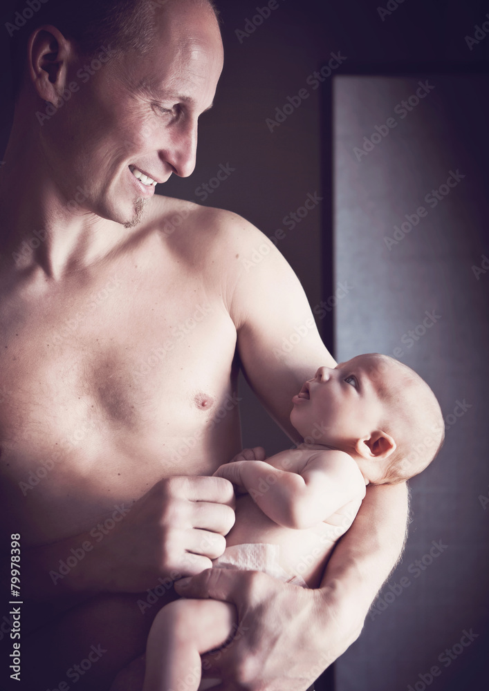 Naklejka premium father holding baby 03