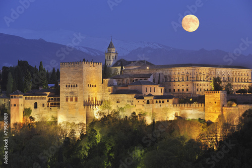 Spain, Andalusia, Granada Province, View of Alhambra Palace illuminated at night photo