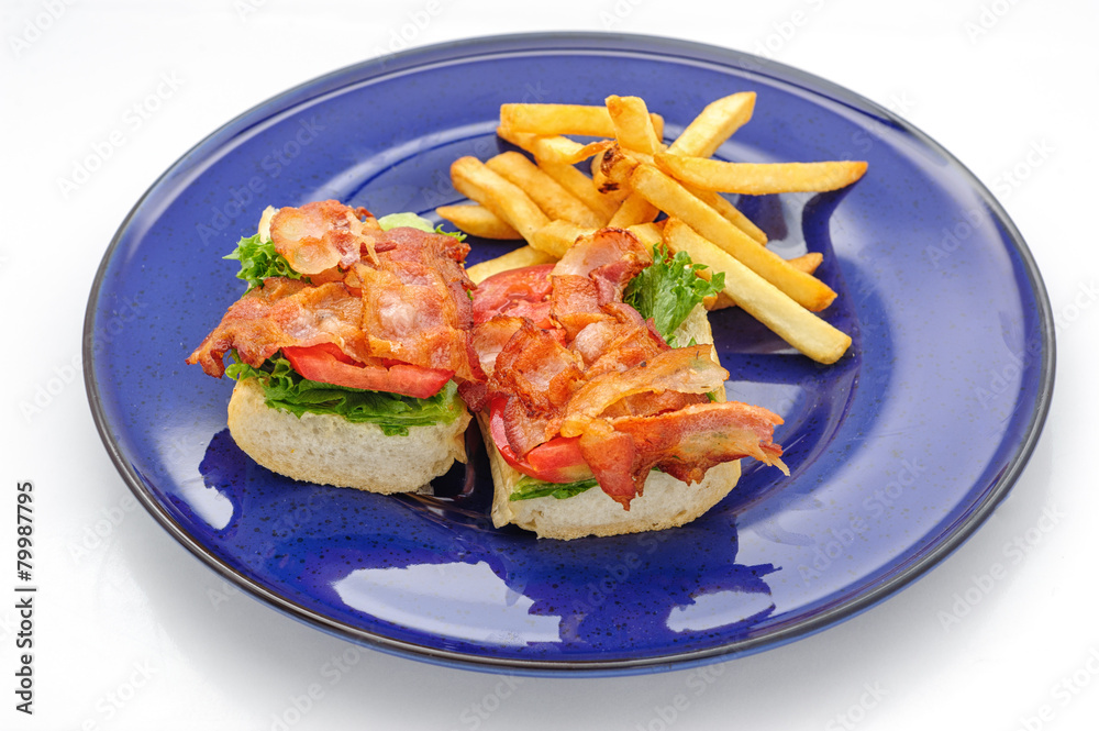 Baguette sandwiches with fried ham on blue plate Baguette sandwiches with fried ham on blue plate
