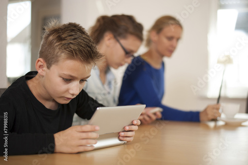 Mother and her two children at home photo