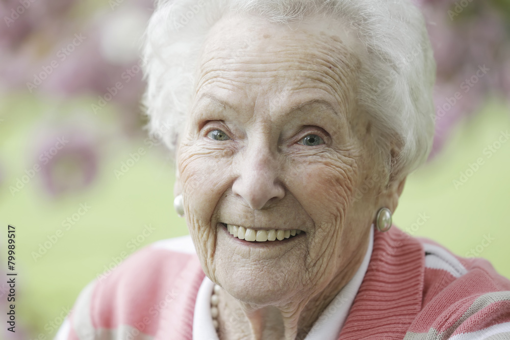 Germany, Cologne, Portrait of senior woman smiling, close up Germany, Cologne, Portrait of senior woman smiling, close up