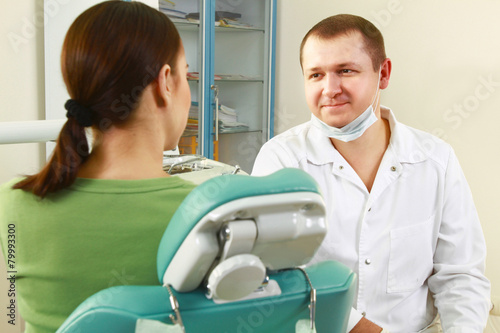 Young woman with dentist in a dental surgery. Healthcare