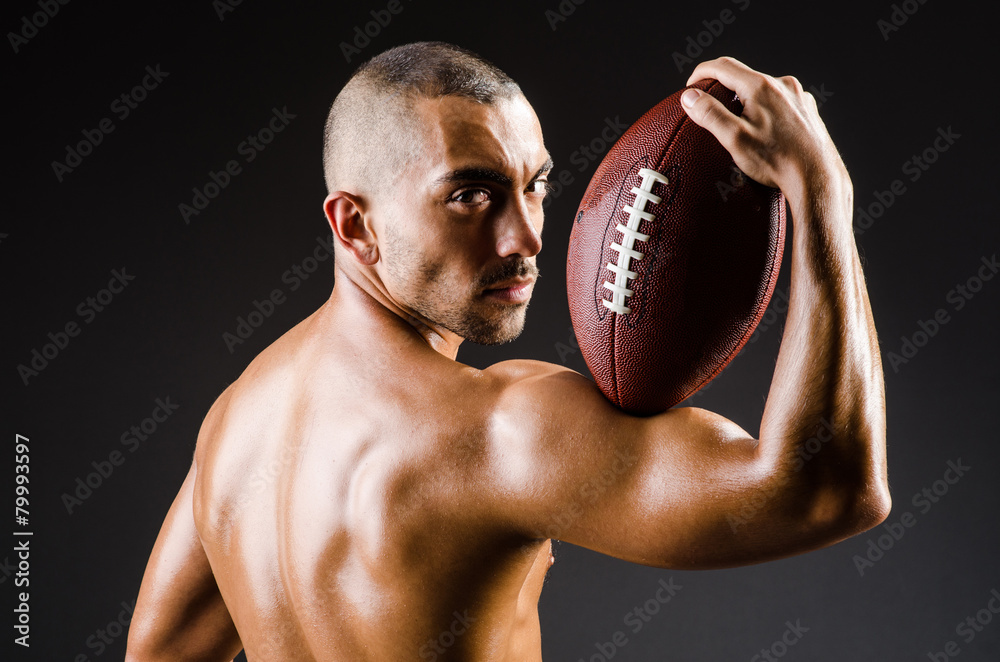 Muscular football player with ball Muscular football player with ball