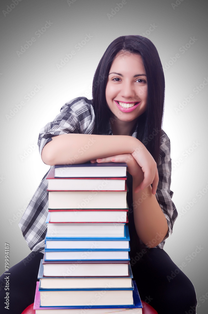 Girl student with books on white