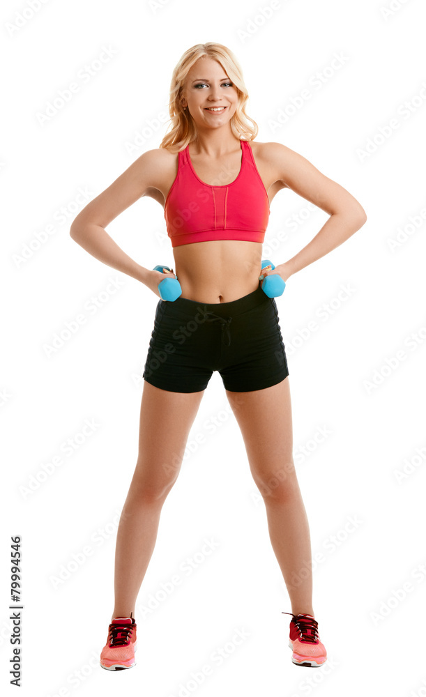 Smiling blonde athlete posing with dumbbells Smiling blonde athlete posing with dumbbells