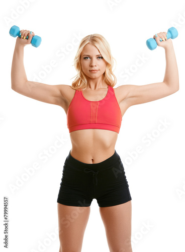 Lovely blonde exercising with dumbbells