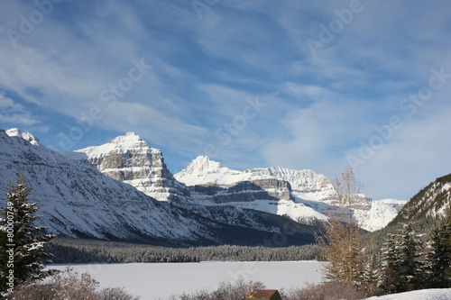 Canadian mountain in front of a frozen lake