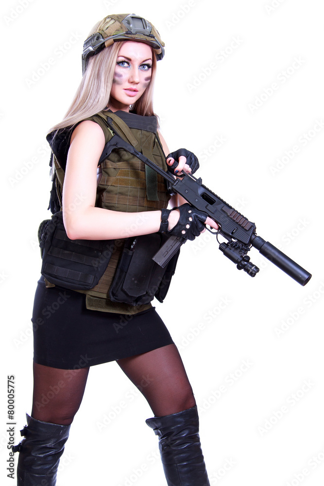 Woman in a military camouflage with a submachine gun Woman in a military camouflage with a submachine gun