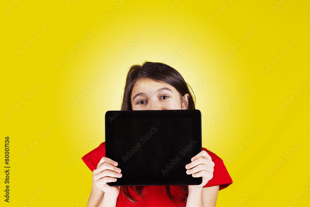 Happy smiling little girl holding tablet Happy smiling little girl holding tablet