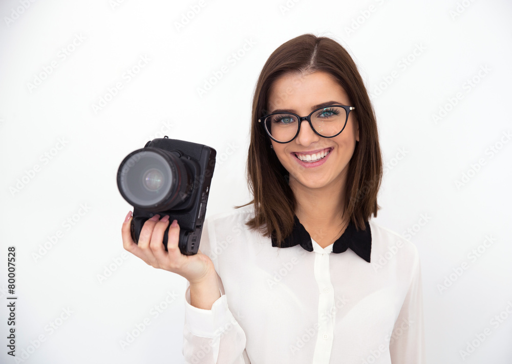Smiling young businesswoman in glasses holding camera Smiling young businesswoman in glasses holding camera