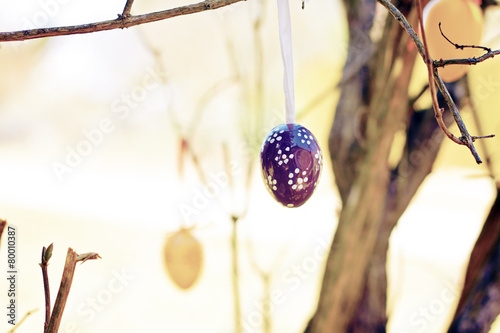 easter eggs outdoor hanging on a bush - greeting card