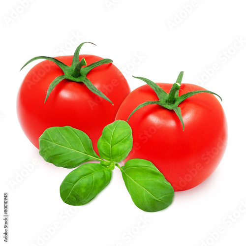Two fresh red tomatoes and basil on isolated backround
