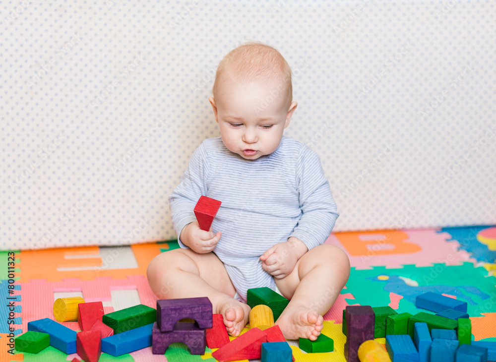 Cute little baby playing with colorful toys Cute little baby playing with colorful toys