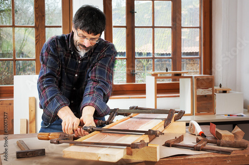 DIY, jointing old wooden planks with glue photo