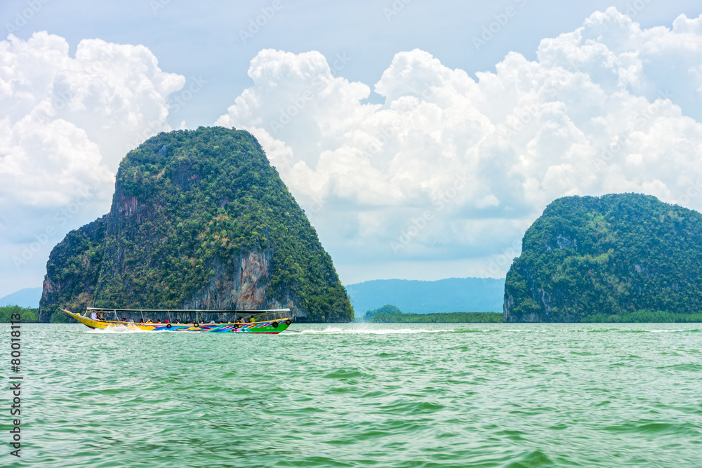 Phang Nga bay and mountain view with dramatic cloud and blue sky Phang Nga bay and mountain view with dramatic cloud and blue sky