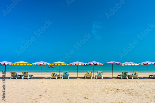 Fototapeta Naklejka Na Ścianę i Meble -  Beach umbrellas and sunbathe seats on Phuket sand beach