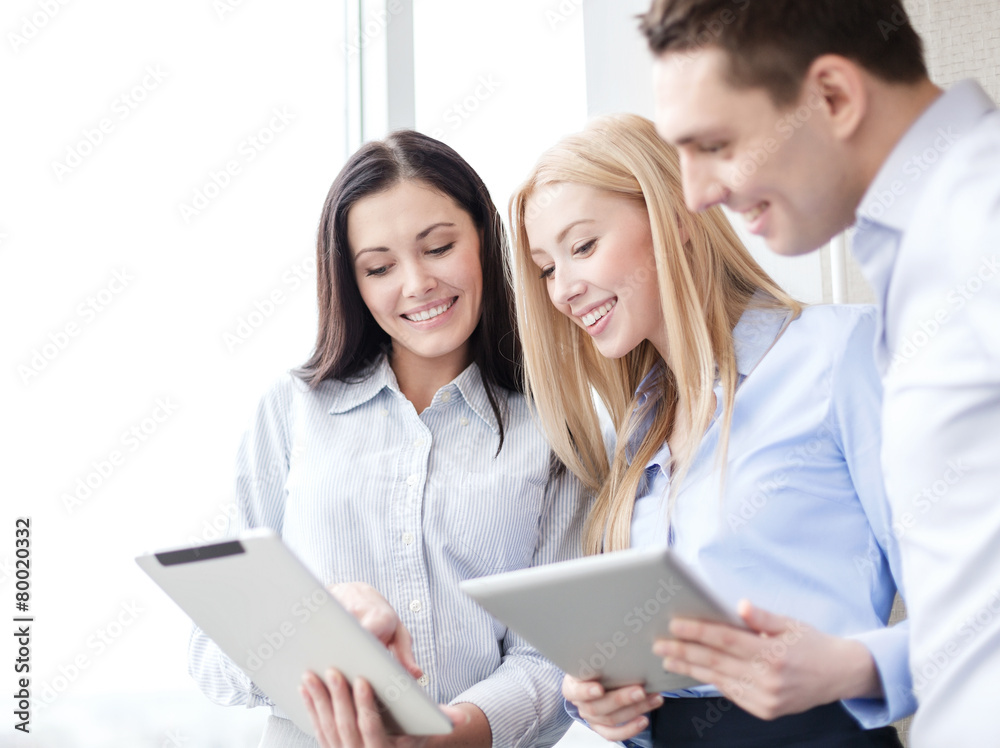 business team working with tablet pcs in office business team working with tablet pcs in office