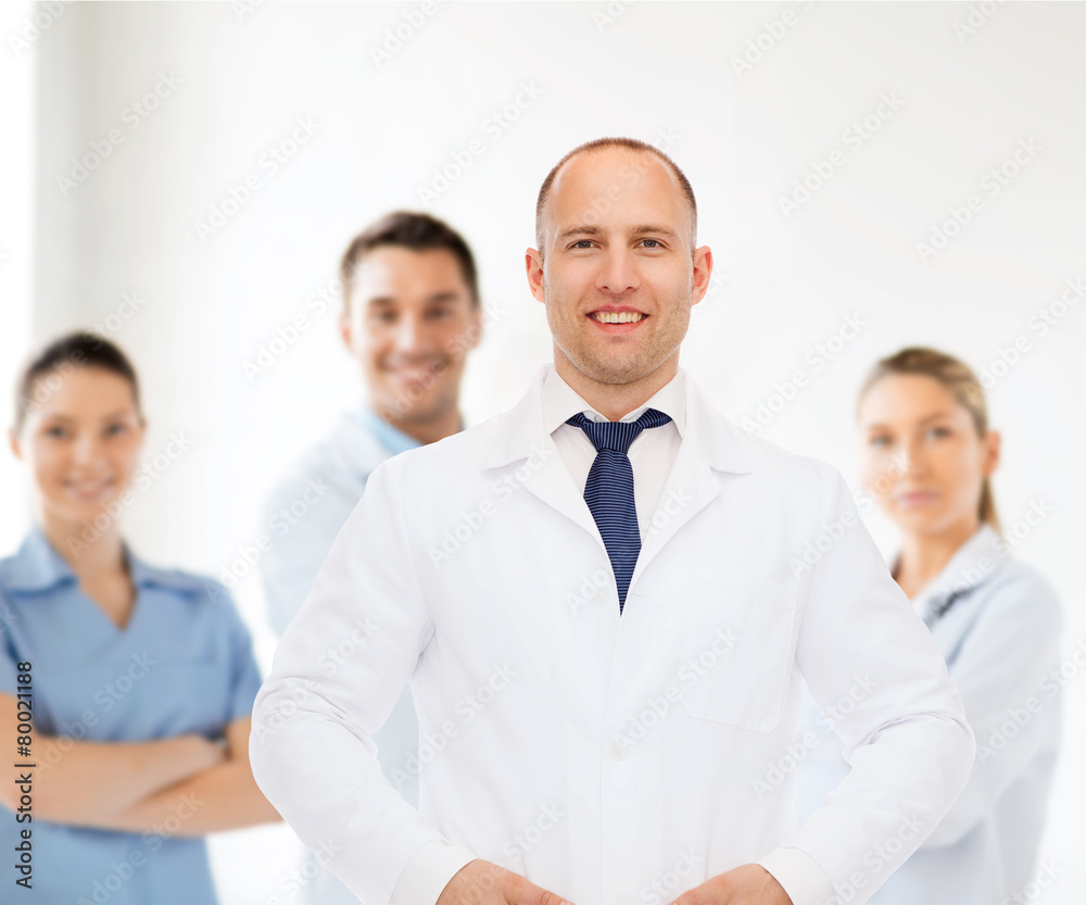 smiling male doctor in white coat smiling male doctor in white coat